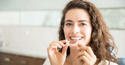 woman with clear aligner