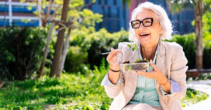 Ladies smile and laugh outside