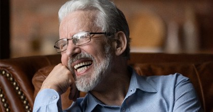 Man with dentures laughing