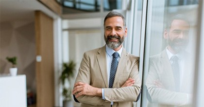 Man smiling in an office building