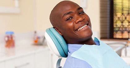 Smiling man in dental chair