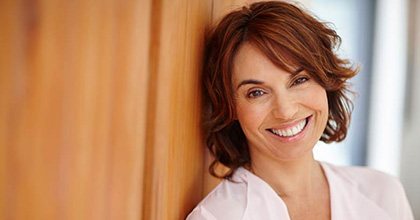 woman smiling with dental implants in Bristol 