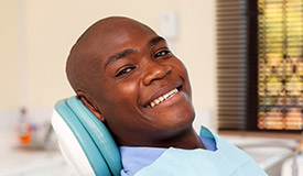 Smiling man in dental chair