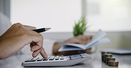 Man using a calculator