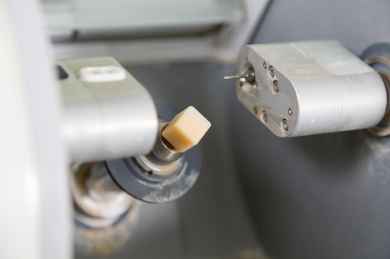 a milling unit preparing to create a CEREC dental crown